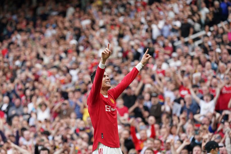 Manchester United's Cristiano Ronaldo celebrates after scoring his third goal during the English Premier League soccer match between Manchester United and Norwich City at Old Trafford stadium in Manchester, England, Saturday, April 16, 2022.  (AP Photo / Jon Super)