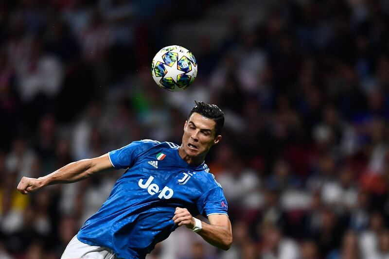 Juventus' Portuguese forward Cristiano Ronaldo heads the ball. AFP