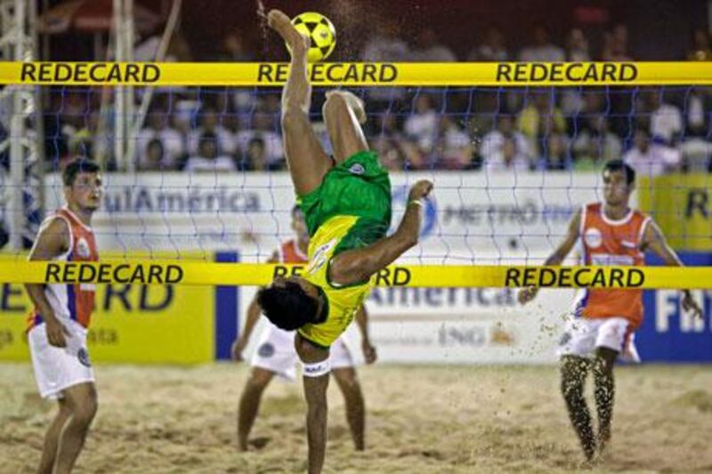 Brazil's Anderson kicks the ball during a Footvolley match with Paraguay at Rio de Janeiro, Brazil, in March.