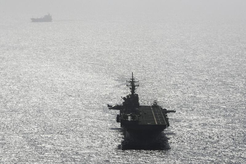 USS Boxer ship sails near a tanker in the Arabian Sea off Oman . Reuters