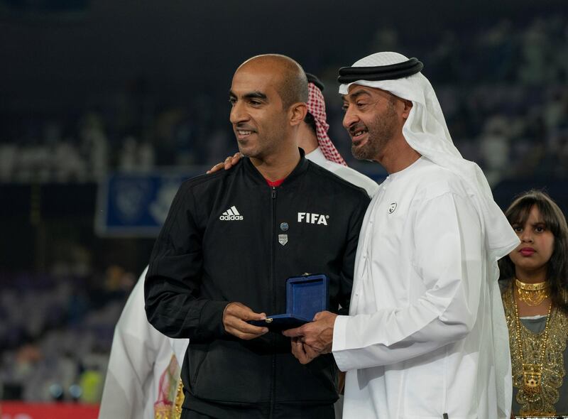 AL AIN, UNITED ARAB EMIRATES - April 18, 2019: HH Sheikh Mohamed bin Zayed Al Nahyan Crown Prince of Abu Dhabi Deputy Supreme Commander of the UAE Armed Forces (R) presents a medal to participant, after Etoile du Sahel won the 2018–19 Zayed Champions Cup, at Hazza bin Zayed Stadium.

( Mohamed Al Hammadi / Ministry of Presidential Affairs )
---