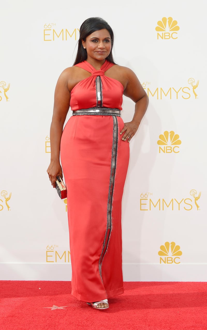 epa04368556 Mindy Kaling arrives for the 66th annual Primetime Emmy Awards held at the Nokia Theatre in Los Angeles, California, USA, 25 August 2014. The Primetime Emmy Awards celebrate excellence in national primetime television programming.  EPA/PAUL BUCK