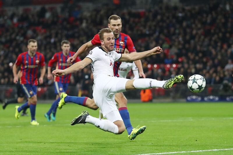 Tottenham's Harry Kane volleys towards goal. Julian Finney / Getty Images