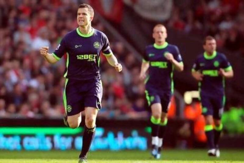 Gary Caldwell celebrates scoring the winning goal for Wigan Athletic at Liverpool.