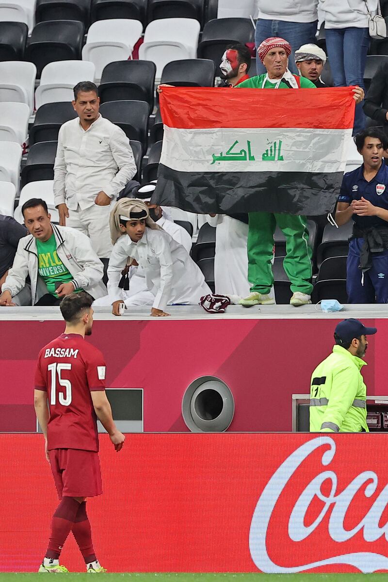 Qatar defender Bassam Al Rawi greets Iraqi fan Mahdi Al Karkhi during the Fifa Arab Cup 2021 match between Qatar and Iraq.