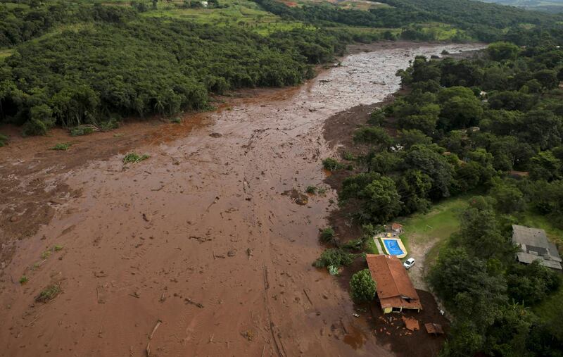 A house damaged by the torrent of sludge and water that poured from the dam when it burst. Reuters