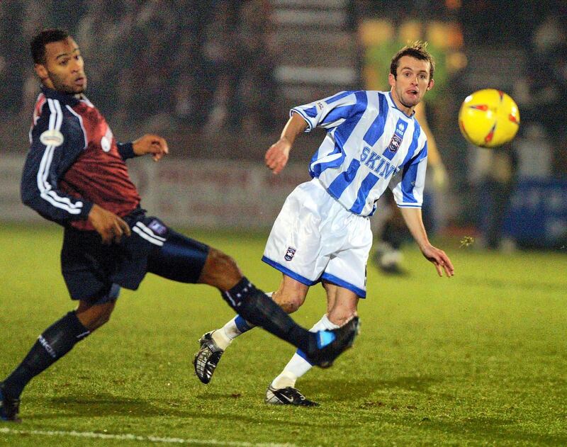 BRIGHTON - DECEMBER 10:  Nathan Jones of Brighton is challenged by Fabian Wilnis of Ipswich during the Nationwide League Division One match between Brighton and Hove Albion and Ipswich Town at the Withdean Stadium in Brighton, England on December 10, 2002. (Photo by Mike Hewitt/Getty Images)