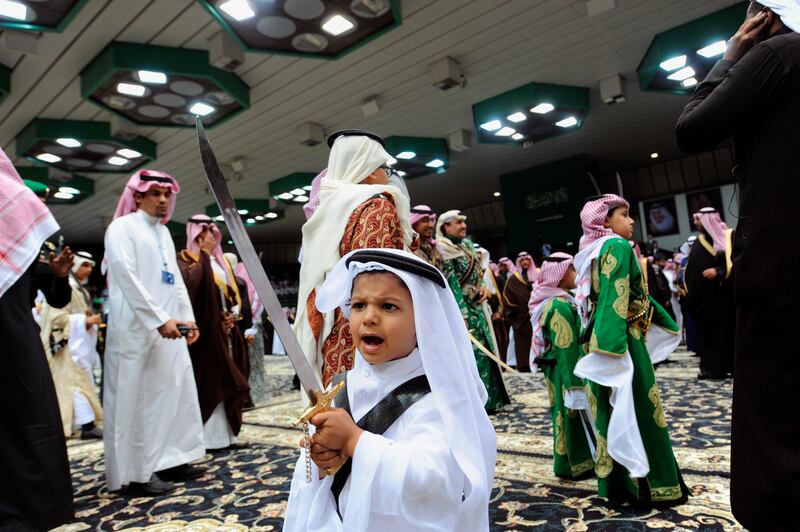 A Saudi Arabian prince holds a sword as part of the traditional Ardah dance, at the Janadriya cultural festival in Riyadh. Reuters