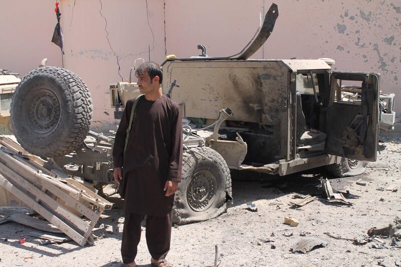 epa06157267 Afghan security officials inspect the scene of a suicide bomb attack near Police barracks, that killed at least 10 people mostly civilians, in Lashkar Gah, Helmand province, Afghanistan, 23 August 2017. The attack comes a day after President of the United States Donald Trump announced an open-ended expansion of its involvement in the Afghan conflict, including raising troop deployment. According to a report by the US Special Inspector General for Afghanistan Reconstruction earlier in the month, the war in Afghanistan has been stagnant with insurgents controlling 40 percent of the country.  EPA/STRINGER