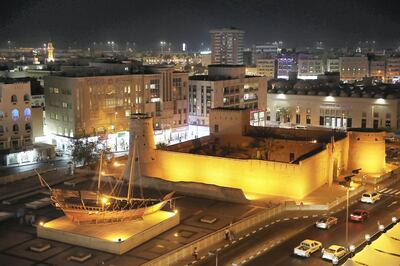 DUBAI , UNITED ARAB EMIRATES , JULY 25 – 2018 :- View of the shops , traditional boat and Dubai Museum in Meena Bazaar area in Dubai. ( Pawan Singh / The National )  For News. Story by Ramola