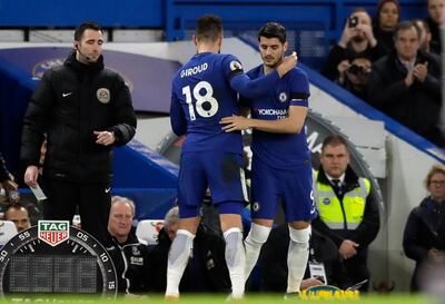 Chelsea's Olivier Giroud, left, is substituted by Chelsea's Alvaro Morata during the English Premier League soccer match between Chelsea and Crystal Palace at Stamford Bridge stadium in London, Saturday, March 10, 2018. (AP Photo/Matt Dunham)