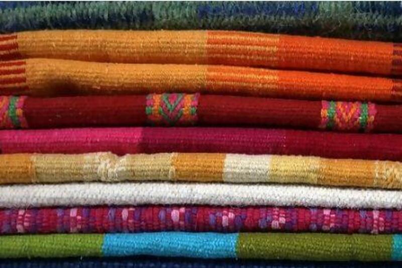 Handwoven fabrics on sale at the Dubai Fabindia. Amy Leang / The National
