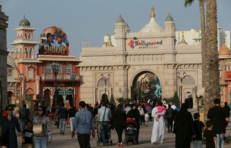 FILE - In this Dec. 18, 2016 file photo, people visit the Bollywood theme park at Dubai Parks & Resorts in Dubai, United Arab Emirates. A massive amusement park in Dubai says it is abandoning plans to build a $454-million Six Flags. DXB Entertainments, which runs Dubai Parks & Resorts, said in a statement filed on Thursday, Feb. 7, 2019 on the local stock market, that a planned financial instrument was "no longer available and the Six Flags Dubai project cannot proceed at this time." (AP Photo/Kamran Jebreili, File)