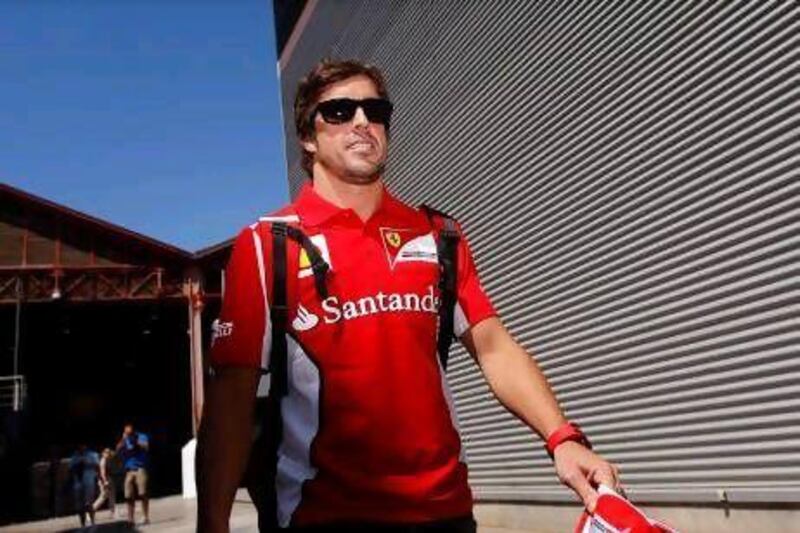 Ferrari's Fernando Alonso enjoys the sunshine in Valencia.