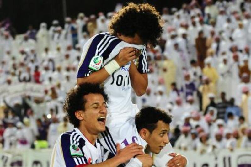 Al Ain's #10 Omar Abdulrahman, #15 Khaled Abdulrahman and #16 Mohamed Abdulrahman celebrate together after defeating Al Jazira.  Photo courtesy of Al Ain FC