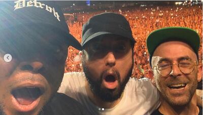 Denaun Porter, left, with Eminem and The Alchemist on stage in Abu Dhabi at du Arena on Friday, October 25, 2019. Instagram / @alanthealchemist