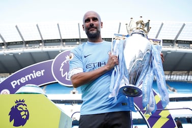 Soccer Football - Premier League - Manchester City vs Huddersfield Town - Etihad Stadium, Manchester, Britain - May 6, 2018   Manchester City manager Pep Guardiola celebrates with the trophy after winning the Premier League title   Action Images via Reuters/Carl Recine    EDITORIAL USE ONLY. No use with unauthorized audio, video, data, fixture lists, club/league logos or "live" services. Online in-match use limited to 75 images, no video emulation. No use in betting, games or single club/league/player publications.  Please contact your account representative for further details.
