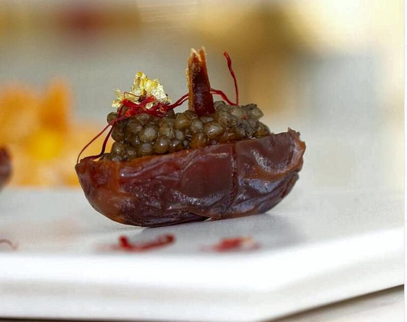 Caviar aux dattes at Beluga restaurant is an entree of medjool dates stuffed with caviar and garnished with saffron.