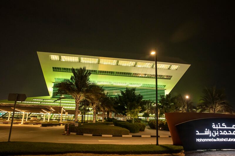 The Mohammed Bin Rashid Library is lit up in anticipation of the opening of the world's fair. Antonie Robertson / The National