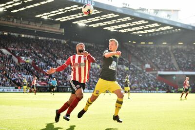 SHEFFIELD, ENGLAND - SEPTEMBER 14: David McGoldrick of Sheffield United battles for possession with James Ward-Prowse of Southampton during the Premier League match between Sheffield United and Southampton FC at Bramall Lane on September 14, 2019 in Sheffield, United Kingdom. (Photo by Nathan Stirk/Getty Images)