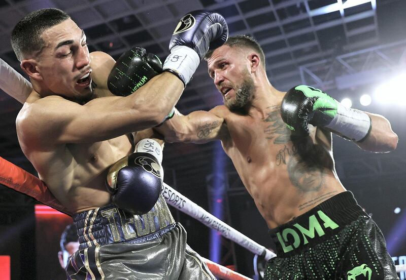 LAS VEGAS, NEVADA - OCTOBER 17: In this handout image provided by Top Rank, Vasiliy Lomachenko punches Teofimo Lopez Jr in their Lightweight World Title bout at MGM Grand Las Vegas Conference Center on October 17, 2020 in Las Vegas, Nevada. (Photo by Mikey Williams/Top Rank via Getty Images)