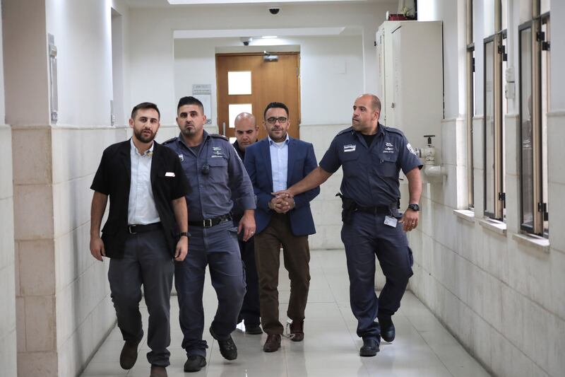 Israeli forces accompany Palestinian Authority Jerusalem Governor Adnan Ghaith before his trial in the Israeli court in 2018 in Jerusalem. Wafa

 (Photo by Mostafa Alkharouf /Anadolu Agency/Getty Images)