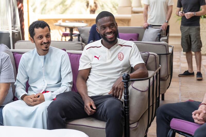 Fikayo Tomori laughs with AC Milan fans at Expo 2020. 