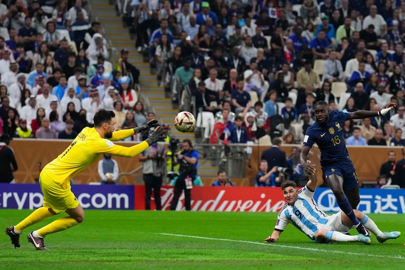 France goalkeeper Hugo Lloris saves from Argentina's Julian Alvarez. AP