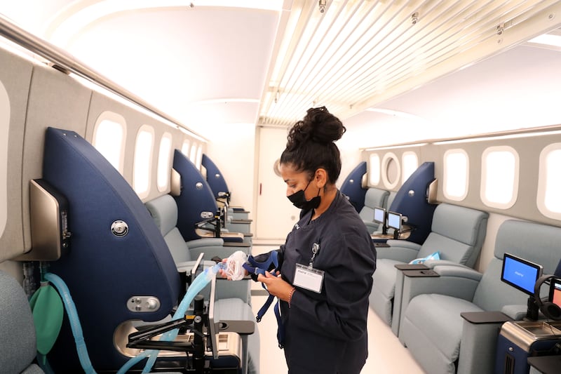 Inside the hyperbaric chamber, a member of staff prepares the oxygen masks. Chris Whiteoak / The National