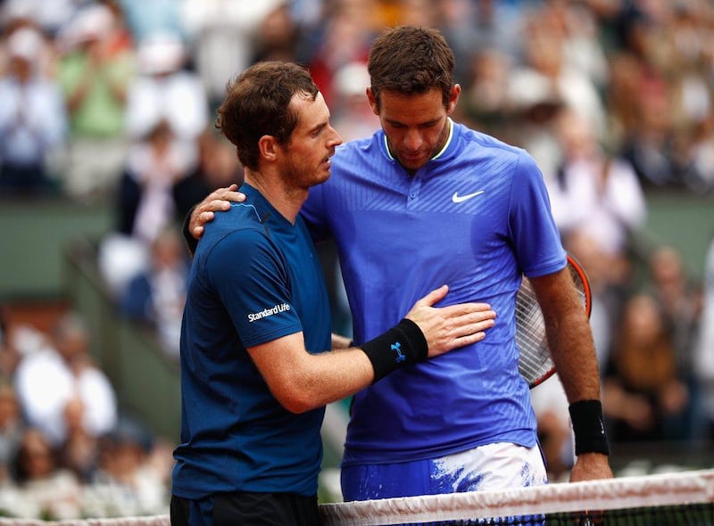 Andy Murray, left, and Juan Martin Del Potro, right, greet each other at the net after their French Open third round match. Adam Pretty / Getty Images