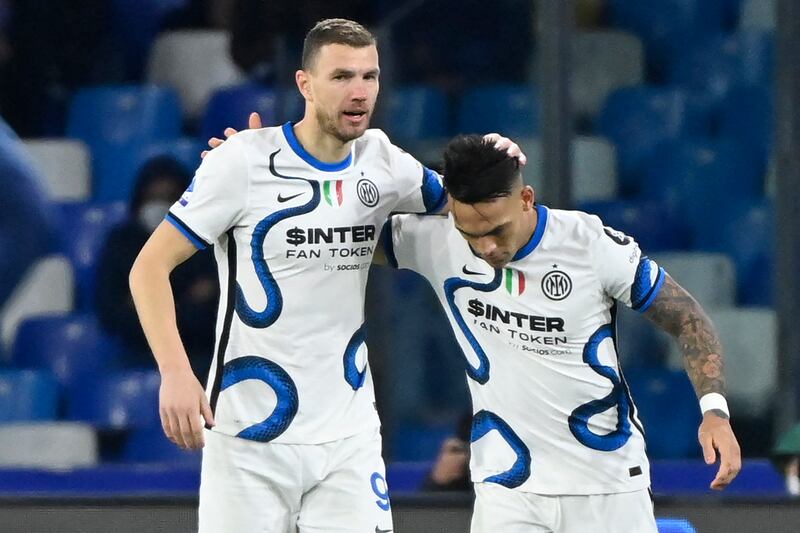 Inter Milan's Edin Dzeko celebrates his goal with teammate Lautaro Martinez. AFP