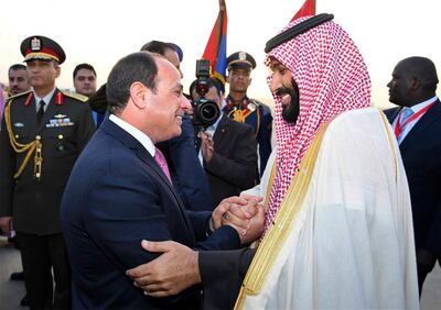 Egyptian President Abdel-Fattah el-Sissi, left, greets Saudi Crown Prince Mohammed bin Salman on his arrival to Cairo, Egypt, for a visit meant to deepen the alliance between two of the region's powerhouses, Sunday, March 4, 2018. Soon after the prince touched down in Cairo Sunday, el-Sissi's office said "regional issues" and Egypt's fight against Islamic militants were discussed by phone with U.S. President Donald Trump. (Mohammed Samaha/MENA via AP)
