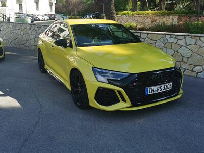 The Audi RS3 is identifiable by a wider front bumper and huge gloss-black honeycomb grille.