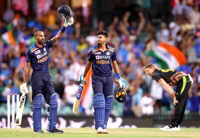 India's Hardik Pandya (L) and teammate Shreyas Iyer celebrate the victory as Australia's Daniel Sams (R) reacts during the second T20 cricket match between Australia and India at the Sydney Cricket Ground in Sydney on December 6, 2020.  / IMAGE RESTRICTED TO EDITORIAL USE - STRICTLY NO COMMERCIAL USE
 / AFP / DAVID GRAY / / IMAGE RESTRICTED TO EDITORIAL USE - STRICTLY NO COMMERCIAL USE

