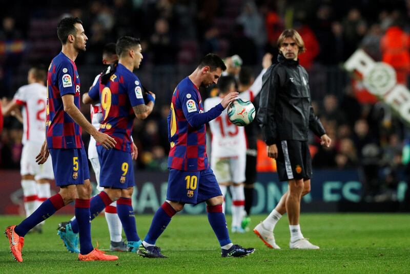 Barcelona's Lionel Messi with the matchball after the match. Reuters
