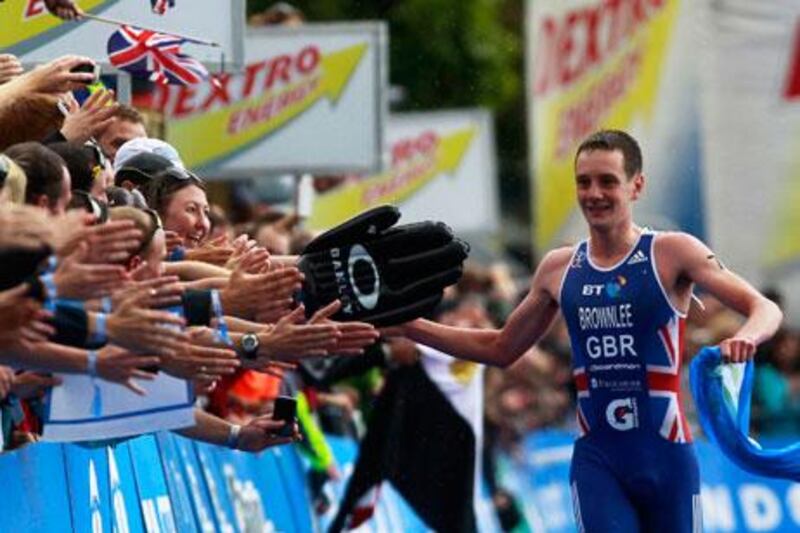 Alistair Brownlee took a victory jog after winning the men's London Triathlon by 25 seconds.
