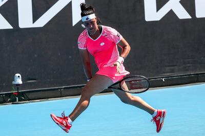 epa09000305 Ons Jabeur of Tunisia in action against Anna Karolina Schmiedlova of Slovakia in the second round match on day 3 of the Australian Open Grand Slam tennis tournament in Melbourne, Australia, 10 February 2021.  EPA/JASON O'BRIEN