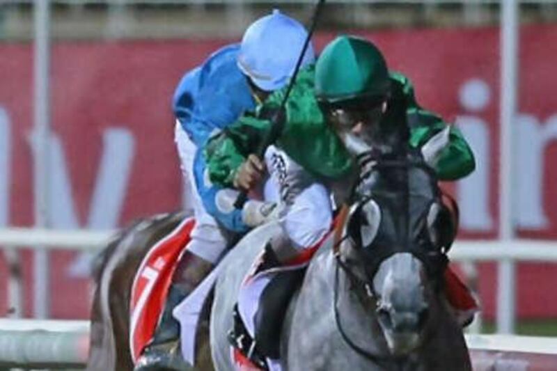 Dubai Dreamer with jockey Royston French leads the race as Fight with jockey Gaven Birrer chases for the Arabian Adventures Trophy.