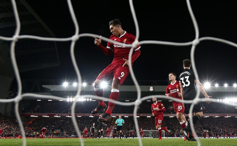 LIVERPOOL, ENGLAND - DECEMBER 26:  Roberto Firmino of Liverpool celebrates a goal during the Premier League match between Liverpool and Swansea City at Anfield on December 26, 2017 in Liverpool, England.  (Photo by Jan Kruger/Getty Images)