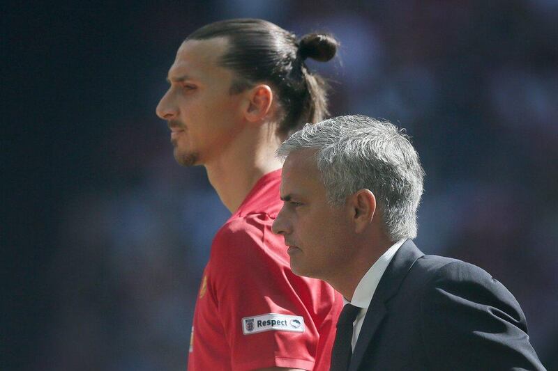 Manchester United manager Jose Mourinho, right, with Manchester United's Zlatan Ibrahimovic during the Community Shield soccer match between Leicester and Manchester United at Wembley stadium in London, Saturday April 9, 2016. (AP Photo/Tim Ireland)