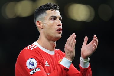 (FILES) In this file photo taken on April 28, 2022, Manchester United's Portuguese striker Cristiano Ronaldo applauds supporters after the English Premier League football match between Manchester United and Chelsea in Manchester, England.  - US district judge, Judge Jennifer Dorsey, in Las Vegas on June 10, 2022, dismissed a rape lawsuit against Ronaldo, castigating the legal team behind the complaint.  Dorsey threw out the case brought by Kathryn Mayorga of Nevada, who alleged she was assaulted by the Portuguese soccer star in a Las Vegas hotel room in 2009.  (Photo by Lindsey Parnaby / AFP) / RESTRICTED TO EDITORIAL USE.  No use with unauthorized audio, video, data, fixture lists, club/league logos or 'live' services.  Online in-match use limited to 120 images.  An additional 40 images may be used in extra time.  No video emulation.  Social media in-match use limited to 120 images.  An additional 40 images may be used in extra time.  No use in betting publications, games or single club/league/player publications.   /  