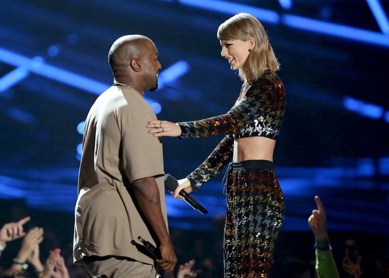 Taylor Swift, right, presents the video vanguard award to Kanye West. Matt Sayles / Invision / AP