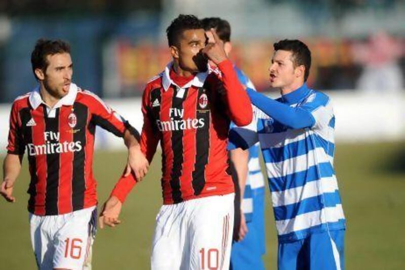 Kevin Prince Boateng, centre, leaves the pitch as a result of racist chanting during AC Milan's friendly with Pro Patria, on Thursday, an act that has received support across Italy.