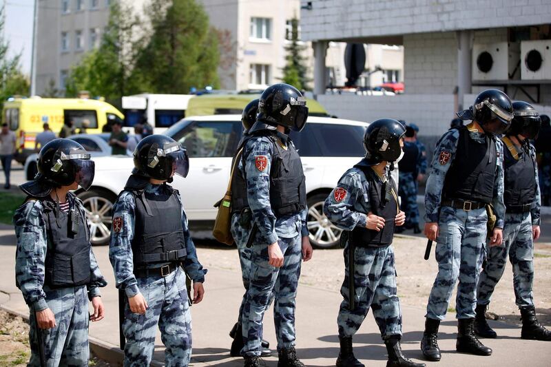 Law enforcement officers are seen at the scene of a shooting at School No. 175 in Kazan. AFP