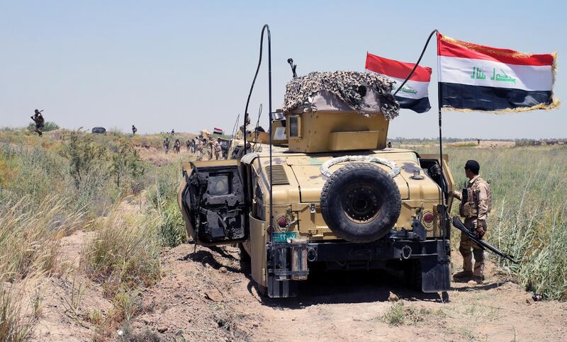 epa05329063 Iraqi military trucks take up position during a military operation southwest of Fallujah city, western Iraq on 25 May 2016. The Iraqi Army on 23 May began an offensive to take back the city of Fallujah, located around 50 kilometers east of Baghdad in the western province of Al Anbar, from the hands of the Islamic State (IS).  EPA/NAWRAS AAMER