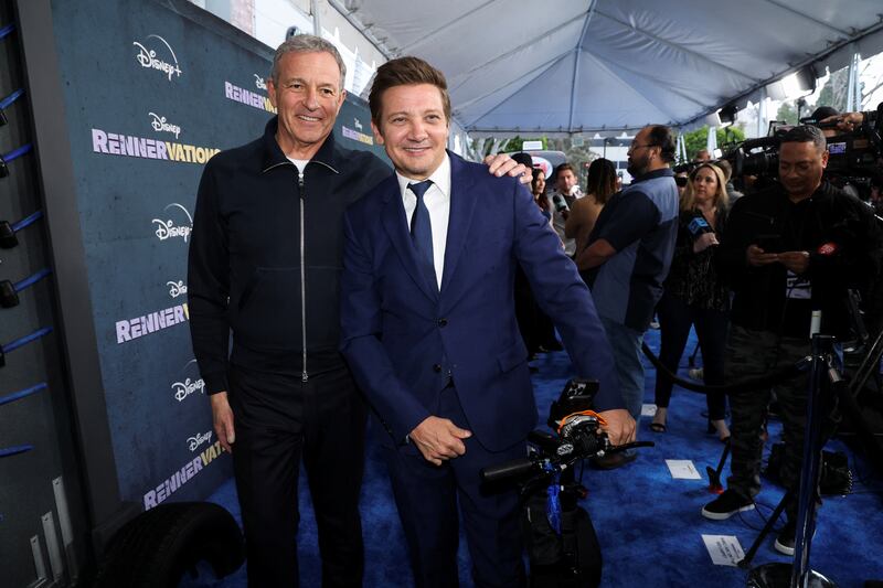 Renner with Disney chief executive Robert Iger at the premiere. Reuters 