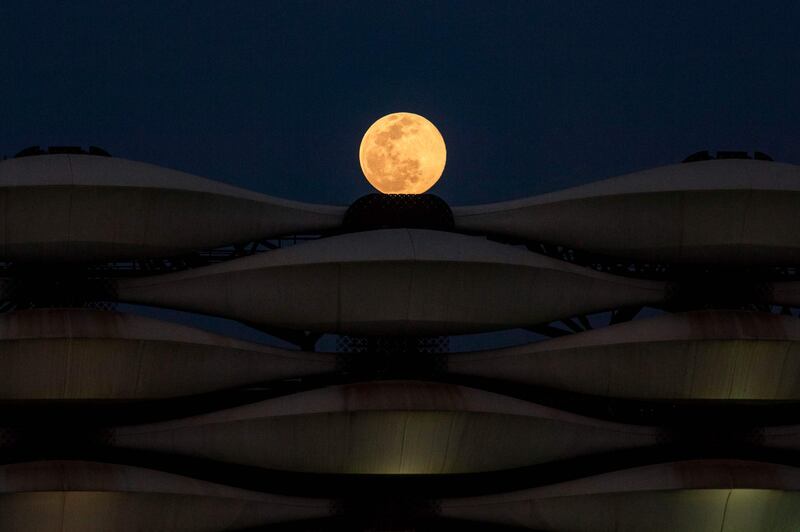A view of the rising full moon above Basra International Stadium in the southern Iraqi city on March 28, 2021. AFP