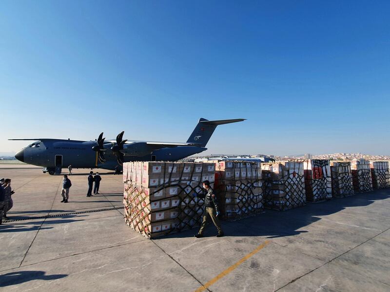 Turkish soldiers load medical protection equipment into a Turkish military cargo plane to be donated to the United States at the Etimesgut airport in Ankara, Turkey, April 28, 2020. EPA