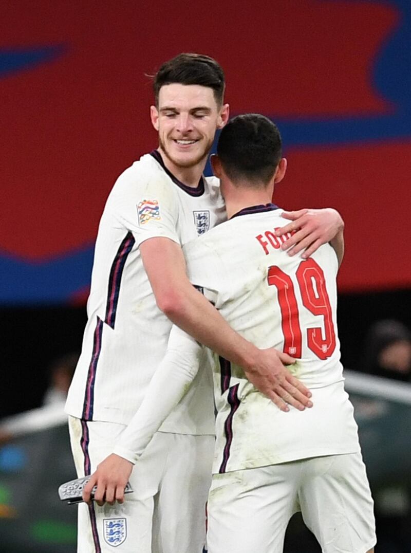 SEngland's Declan Rice and Phil Foden celebrate after the match. Reuters