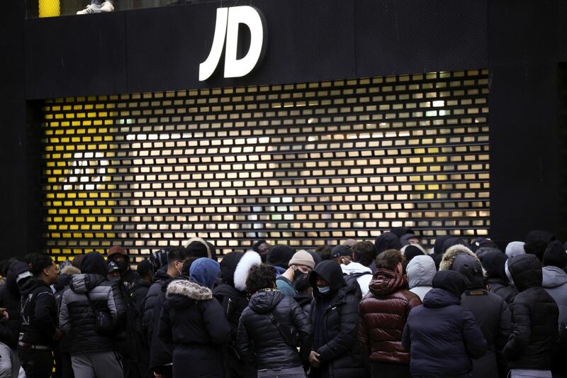 People queue outside a shop on Oxford Street, London. Reuters